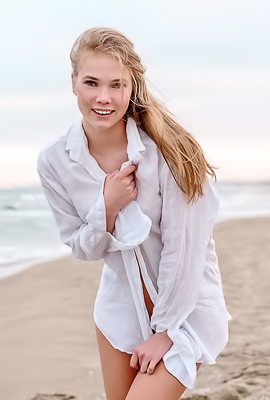 Luise Entices With A Beach Striptease Revealing Perky Nipples And Grabbing Her Curves